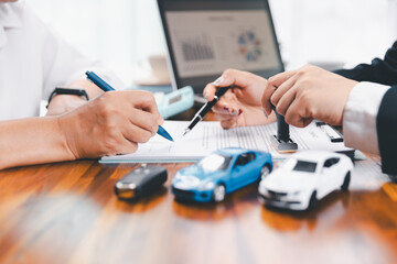ฺBusinessman approval stamper stamp on paper business contract. car loan money approved. Dealer or manager gives car to customer sign car purchase document with insurance, contract to buy car legal.