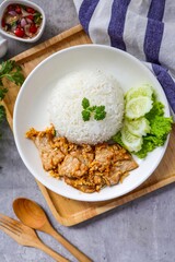 Stir fried Garlic pork with rice in white plate