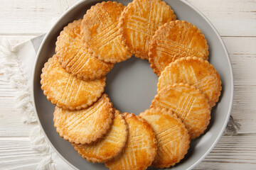 Breton Butter Cookies Sable closeup on the plate on the table. Horizontal top view from above