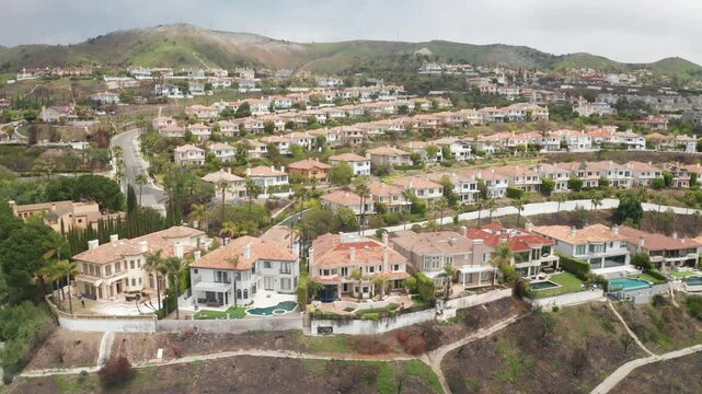 Aerial wide dolly shot of The Summit residential development in Palisades Highlands after the Palisades Fire in Los Angeles, California. 4K