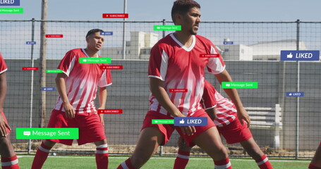 Training mid adult male player defending at artificial turf field, with social media overlays