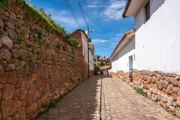 Traditional cobbled streets in Chinchero, Peru, with white adobe walls
