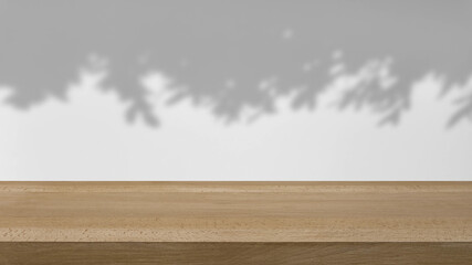 shadow of the trees gently swaying in the breeze, on a white background with a wooden table.