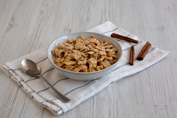 Crunchy Cinnamon Sugar Breakfast Cereal with Milk in a Bowl, side view.