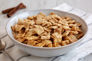 Crunchy Cinnamon Sugar Breakfast Cereal with Milk in a Bowl, side view.
