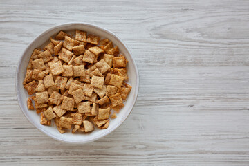 Crunchy Cinnamon Sugar Breakfast Cereal with Milk in a Bowl, top view.