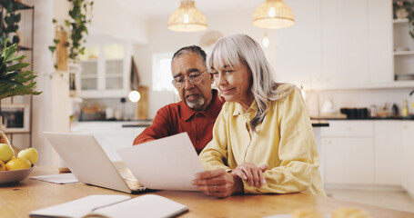 Senior couple, documents and finance in home for results, laptop or smile with review for pension....