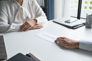 Business people breaking the contract with resignation letter staff reduction resigning leaving the office