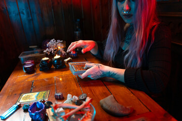 Fortune teller reading tarot cards in mystical atmosphere