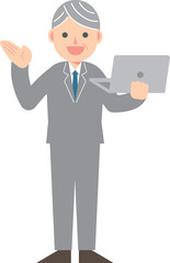 パソコンを片手に説明するビジネスマン