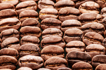 Background of roasted coffee beans. Top view, close-up.