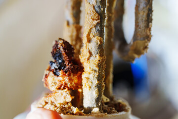 Limescale on the heating element of the water heater.