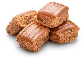 Caramel sweets or butterscotch fudge on white background. File contains clipping path.