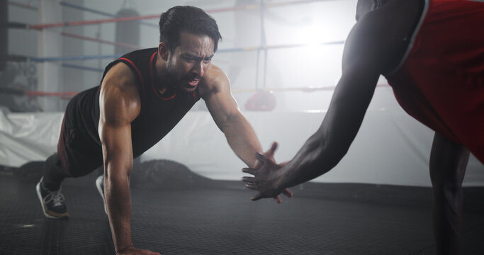 Sports, people and pushup with clap at gym for boxing workout, strength training and endurance challenge. Boxer, personal trainer and fitness for core stability, exercise and competition preparation