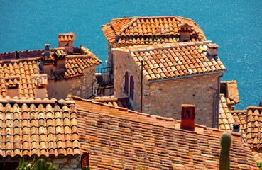 Medieval village Èze in France. Old houses with tiled roofs against the backdrop of the sea