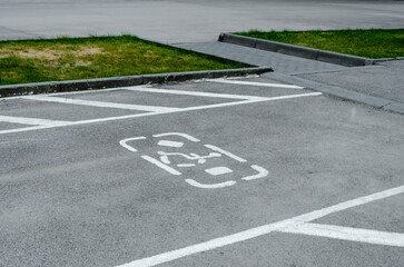 Obraz premium Disabled Parking Space Marking on Asphalt Road