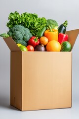 Fresh produce overflowing from cardboard box studio shot healthy eating concept eye level view food delivery service