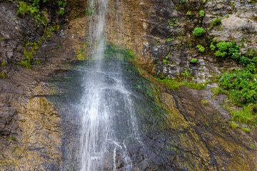 Obraz premium A small waterfall in the south of the island. South Sakhalin, Russia