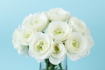 Fototapeta premium vase filled with white flowers sitting on top of a table