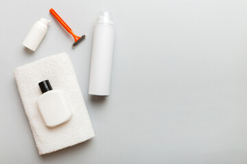 shaving man set. shaving machine, towel, lotion and shaving foam on colored background. Men bath Accessories top view