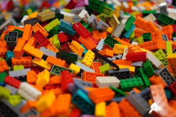 Naklejka premium Bangkok, Thailand - 9 May 2025: Many colorful of Lego bricks were provied for children free playing at the LEGO retail store. Close-up and selective focus.