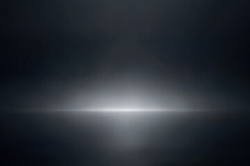 Soft horizontal light fade in dark black studio