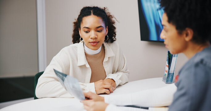Doctor, woman and talking to patient with x ray for medical results or advice in healthcare consultation. Clinic, person and radiology scan with paperwork or document for diagnosis or feedback