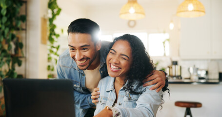 Kitchen, couple and hug with laptop for laughing, support and bonding together with online...