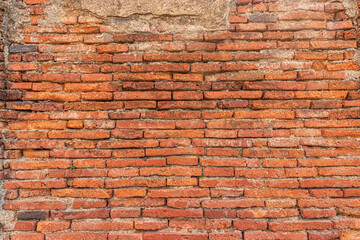 old red brick wall texture background with cement crack on surface
