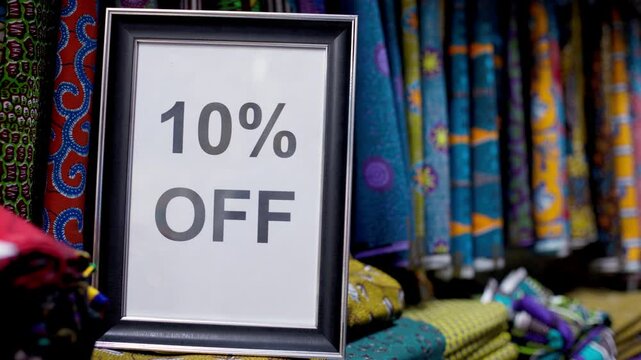 Ten percent off sign at an African Print, Ankara fabric textiles shop.