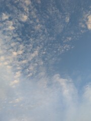 Blue Skies with wispy lines and fluffy white clouds
