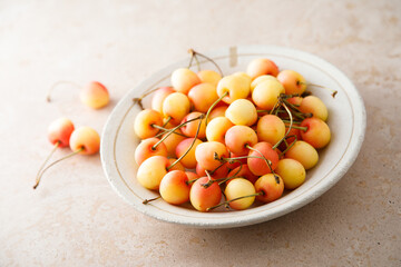 Pink cherry in a bowl