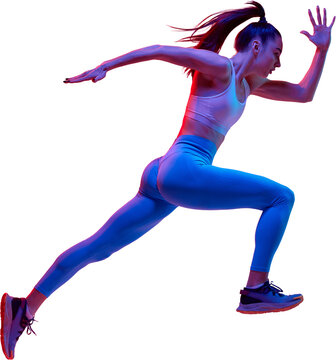 Full-body side view image of young sportive woman, athlete, runner in motion, training isolated on transparent background in neon light. Concept of sportive lifestyle, health, endurance, action