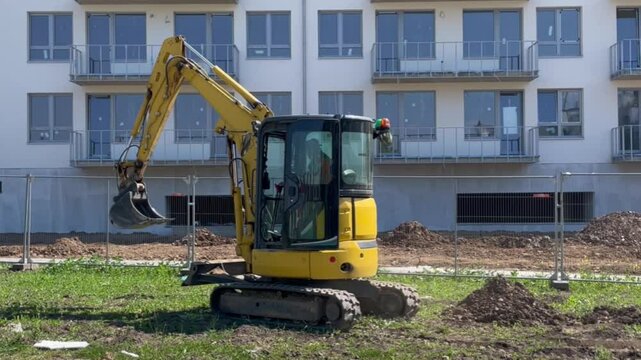 Mini excavator driving through a construction site