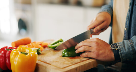 Home, closeup and hands with vegetables for cutting, cooking and nutrition with culinary experience. Kitchen, person and knife with chopping board for pepper, organic food and meal prep in apartment
