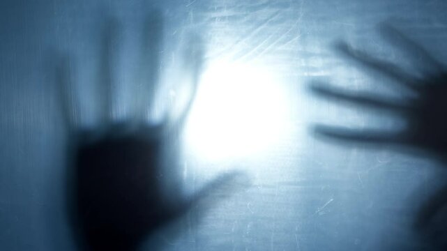 Silhouette of mystical hands. Zombie concept, horror, nightmares. Halloween. Mental health.