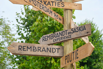 Wooden signs during the Bildtse Rembrandt dagen. In 1634, the famous painter Rembrandt van Rijn married Saskia van Uylenburgh in de van Harenskerk in Sint Annaparochie,