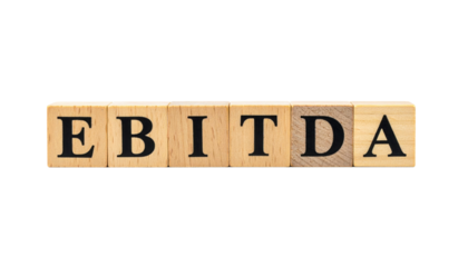Wooden blocks spell out the financial term "EBITDA" in black capital letters.