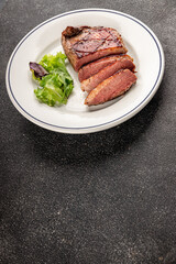 Duck breast roast meat poultry fresh delicious gourmet food background on the table rustic food top view copy space