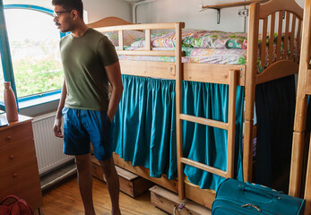 Colourful art hostel in old town with budget-friendly dorms, painted walls, shared kitchen, urban...