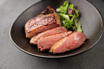 Duck breast roast meat poultry fresh delicious gourmet food background on the table rustic food top view copy space