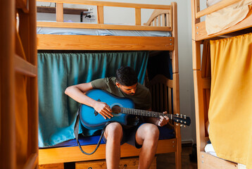 Colourful art hostel in old town with budget-friendly dorms, painted walls, shared kitchen, urban...
