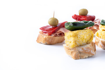 Traditional Spanish pintxos isolated on white background. Copy space