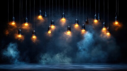 A dramatic display of illuminated incandescent light bulbs hanging from black cords with warm glow and smoky background