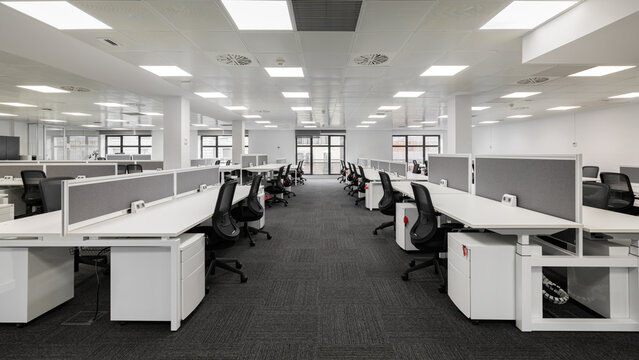 Spacious modern office with open-plan design and ergonomic furniture