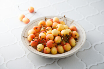 Pink cherry in a bowl