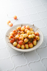 Pink cherry in a bowl