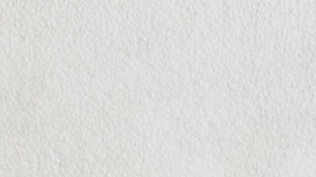 Close up texture of white styrofoam surface. Minimalist background with light shadows. Ideal for material studies or packaging design.