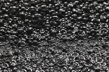 texture bubbles on a black background, soap bubbles, abstract circles, shape abstraction in full screen