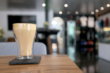 cappuccino, coffee in a clear glass cup in a cafe, soft color background food and drink, hot drink